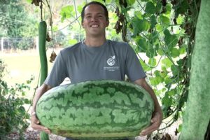 Brandon Huber holding a giant watermelon